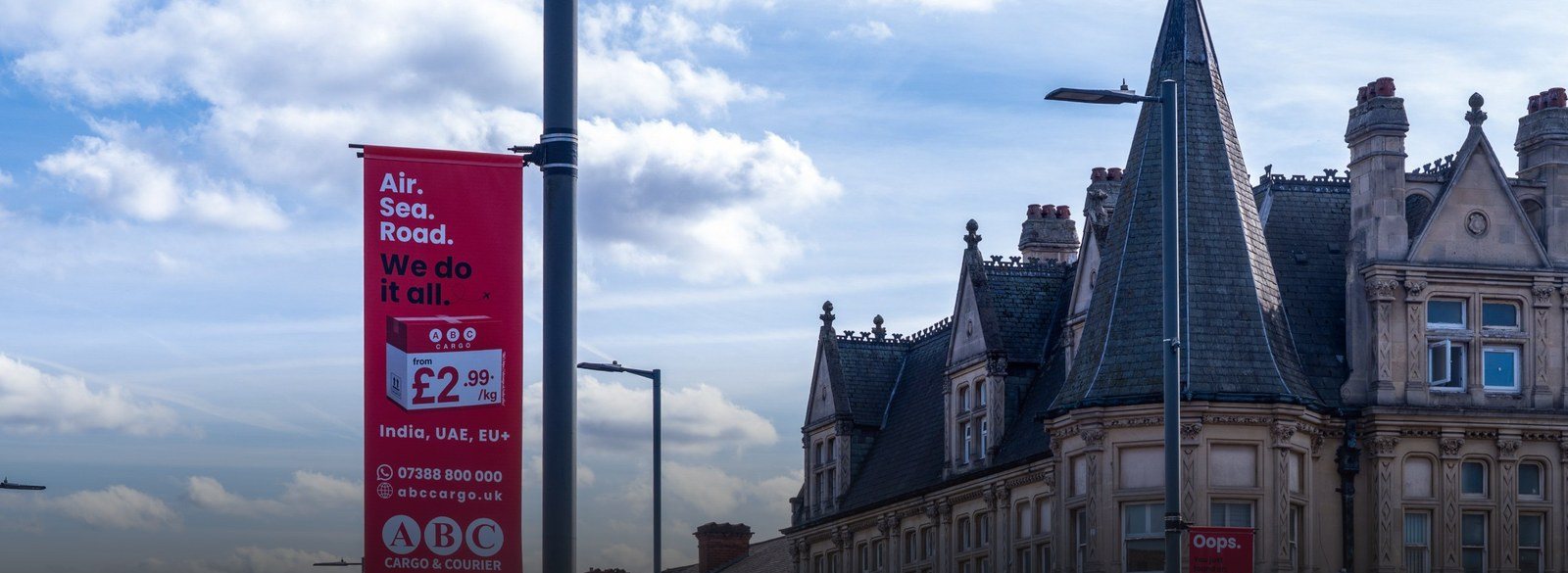 ABC Cargo & Courier lamp-post banner advertising on a Birmingham high street by The One Company