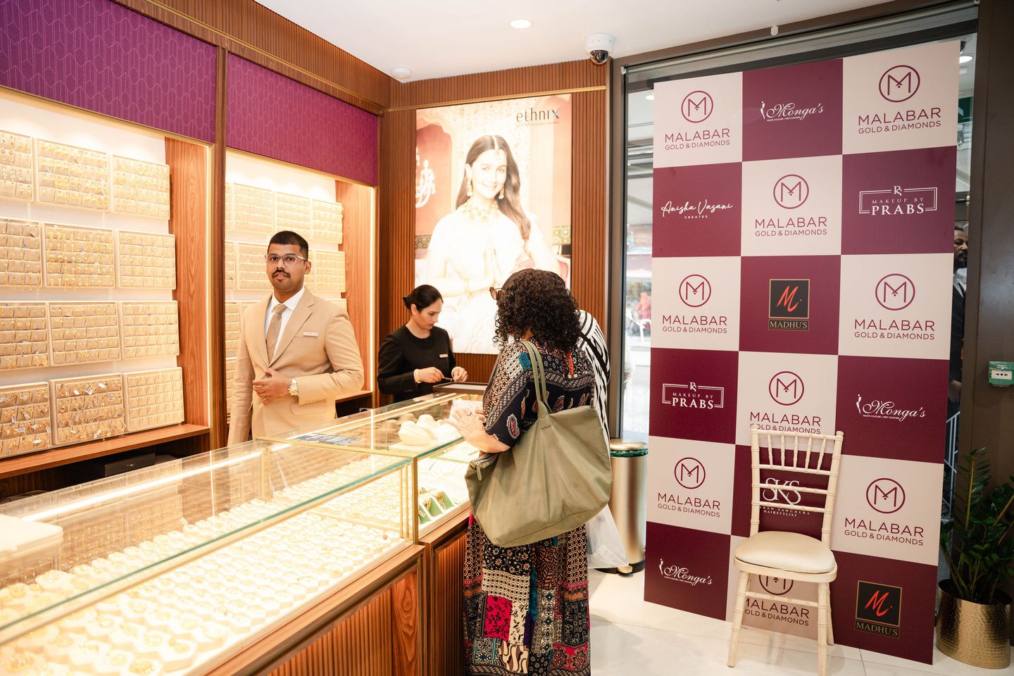 Custom branded media wall beside the jewellery counters